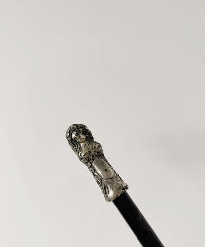 Walking stick with decorated metal handle