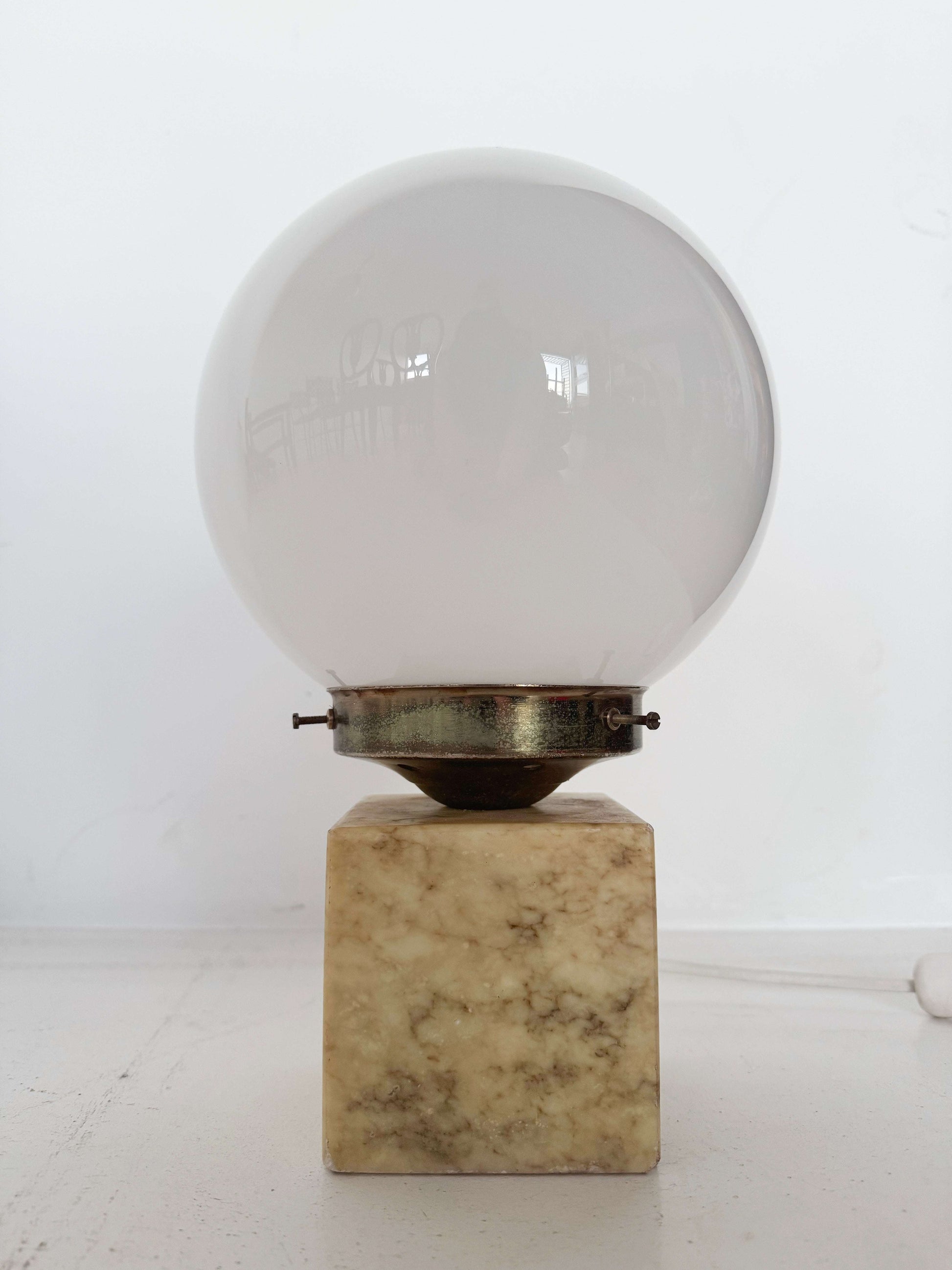 Marble table lamp with opal glass sphere