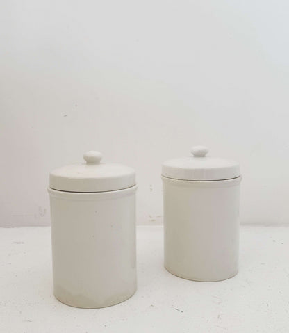 Pair of white ceramic jars with lids