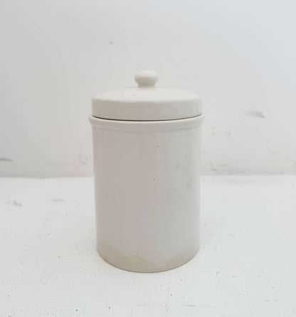 Pair of white ceramic jars with lids