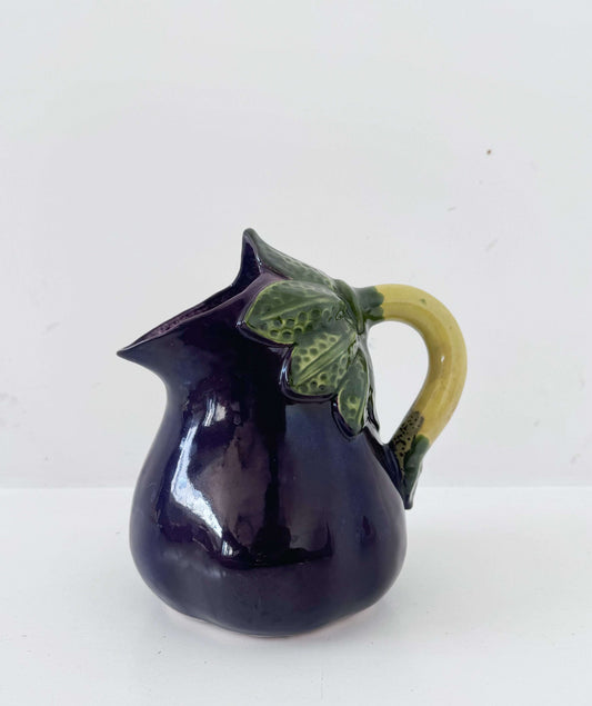Glazed ceramic pitcher shaped like an eggplant