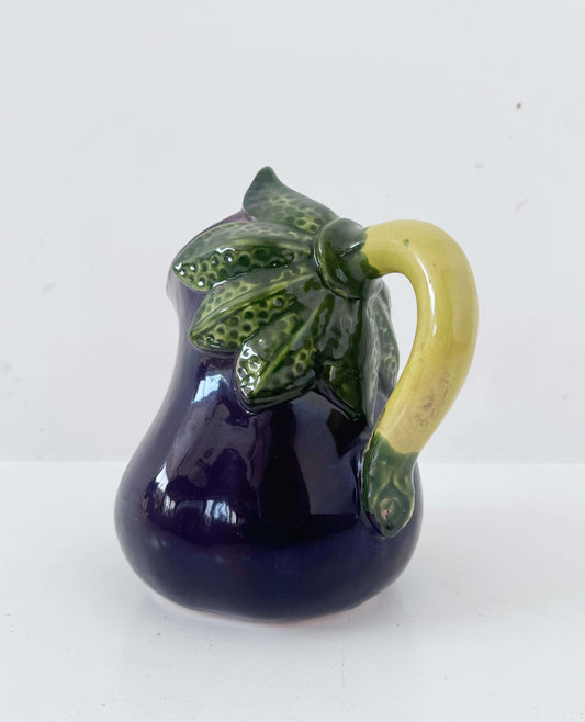 Glazed ceramic pitcher shaped like an eggplant