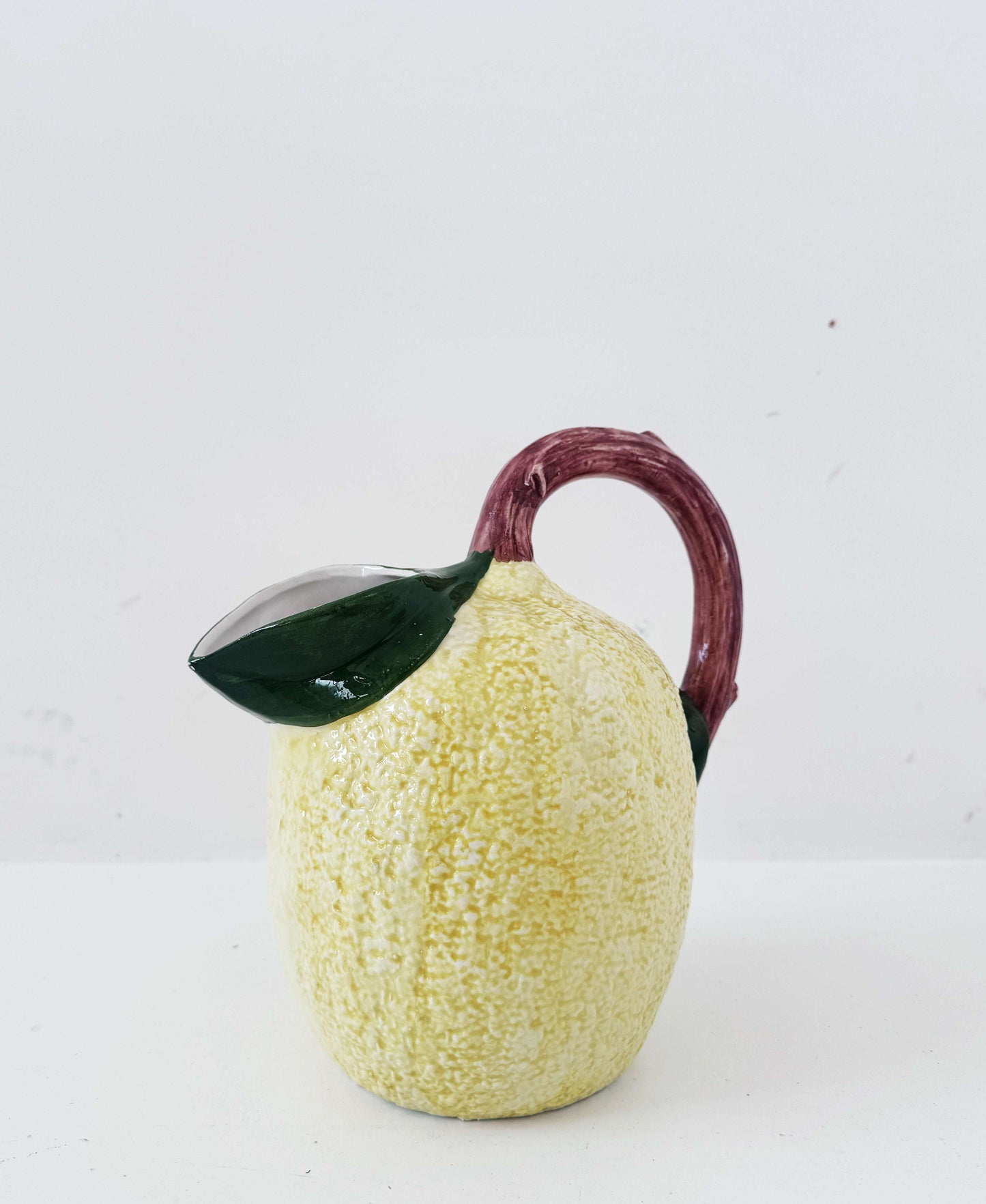 Glazed ceramic lemon-shaped pitcher