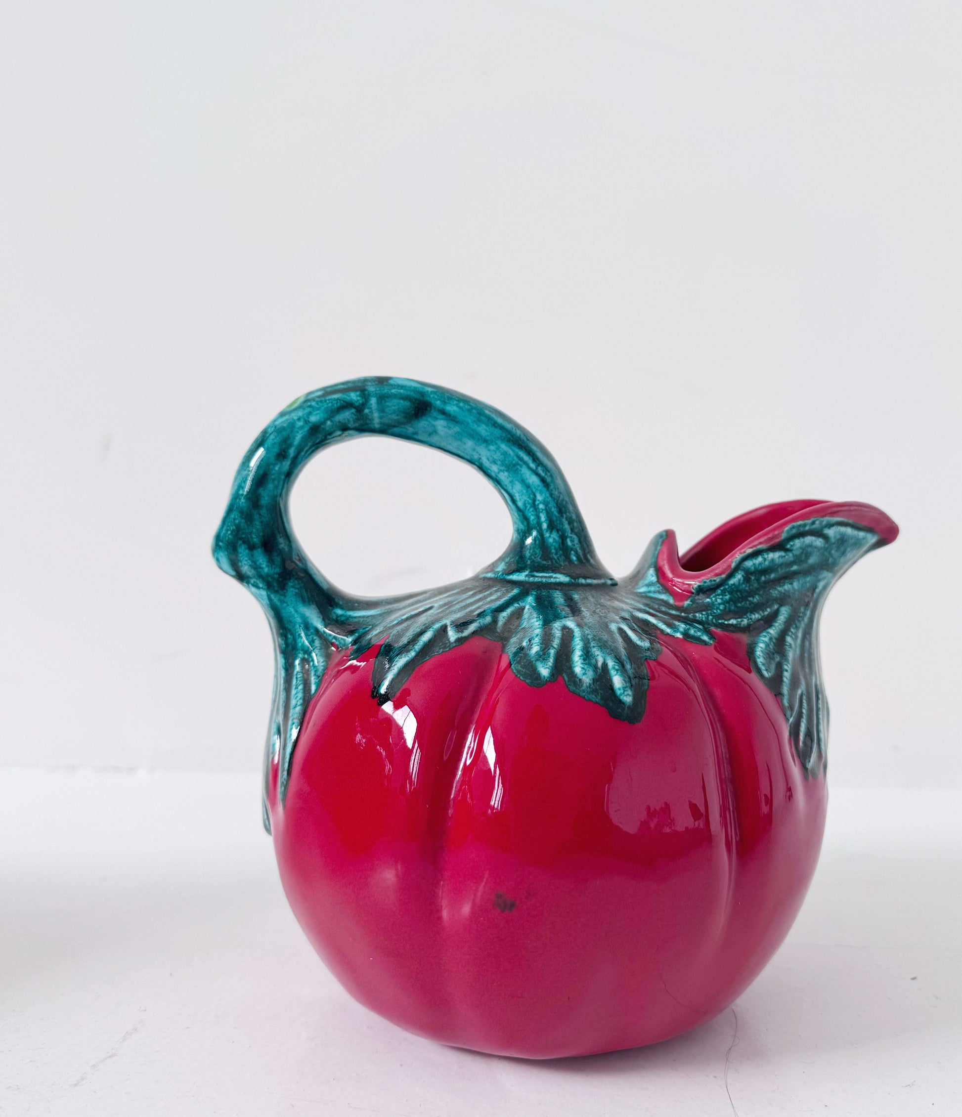 Glazed ceramic tomato-shaped pitcher