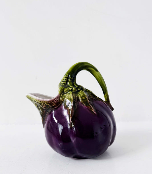 Glazed ceramic pitcher shaped like an eggplant