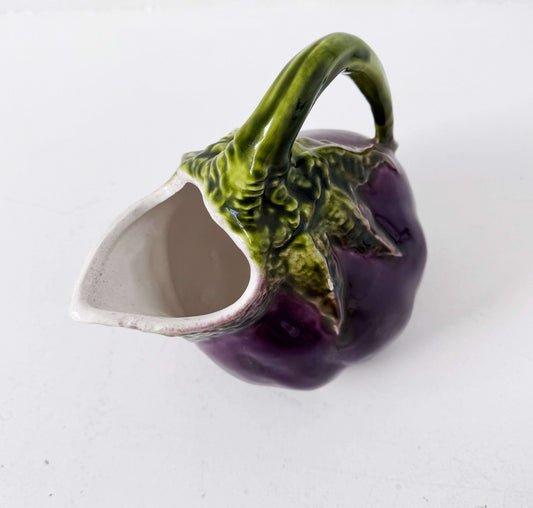 Glazed ceramic pitcher shaped like an eggplant