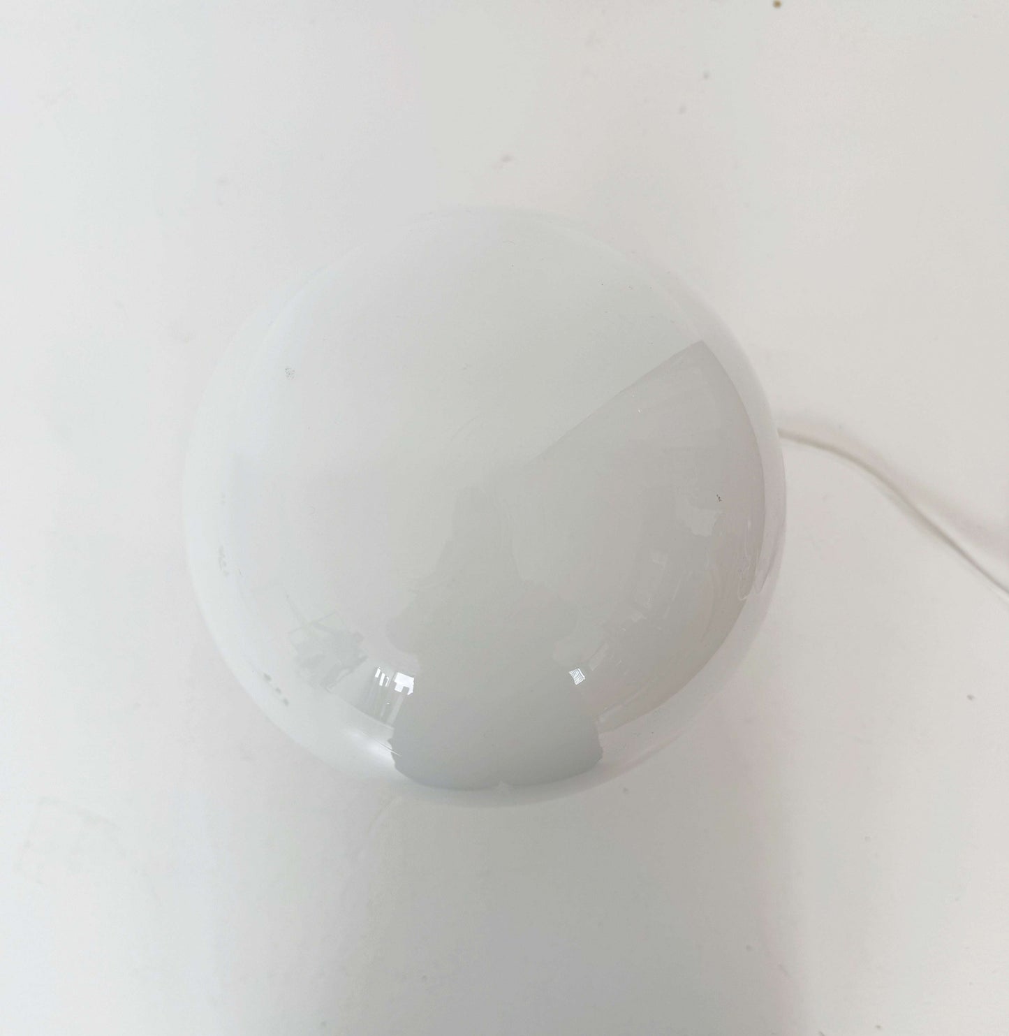 Table lamp with marble base and glass globe