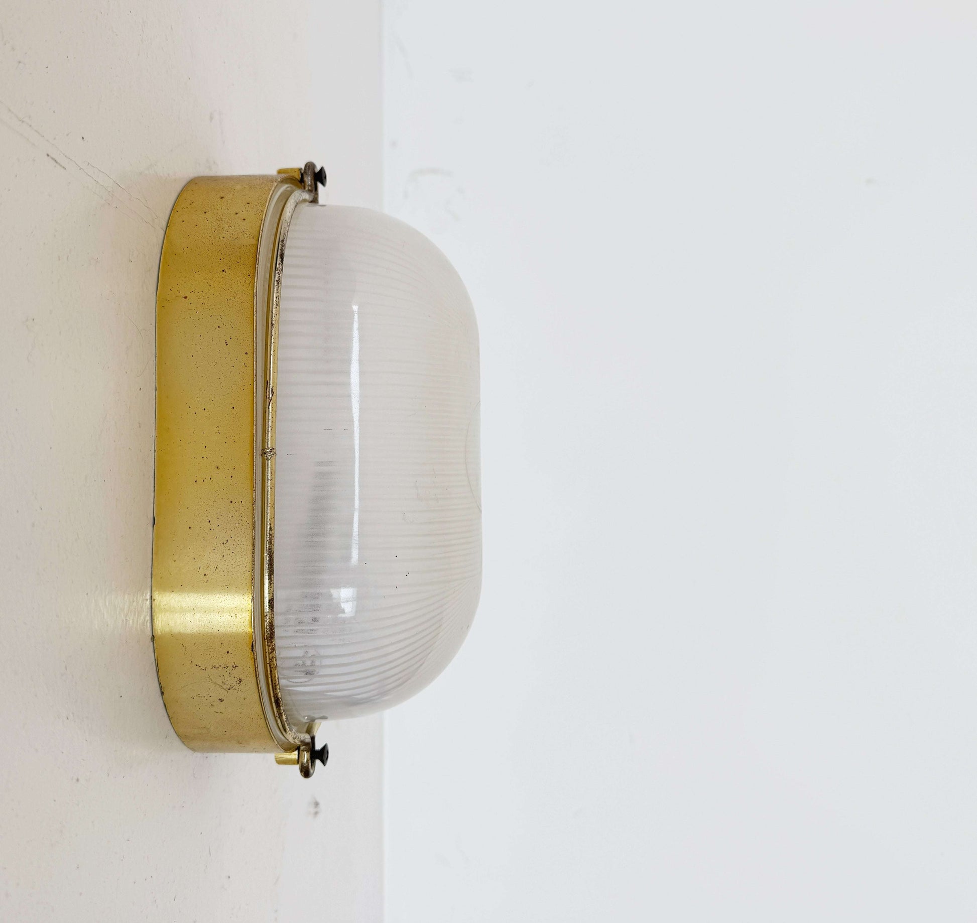 Brass and glass wall light