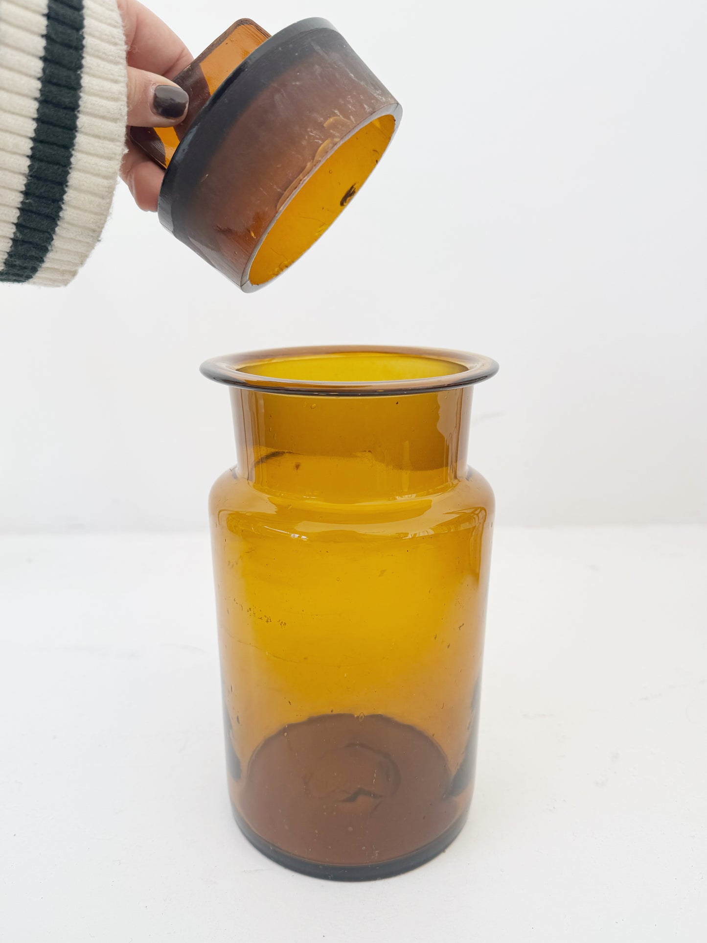 Vintage amber glass apothecary jar with cap