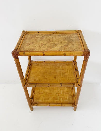 A 1970s bamboo bookcase with three shelves and woven details