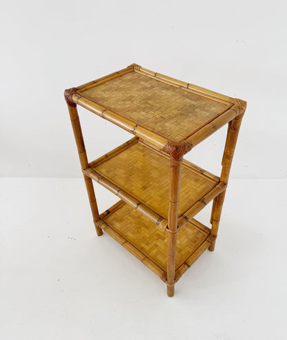 A 1970s bamboo bookcase with three shelves and woven details