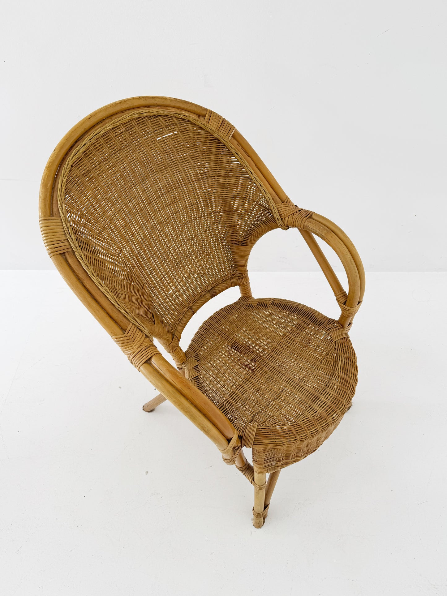 Woven rattan armchair