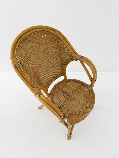 Woven rattan armchair