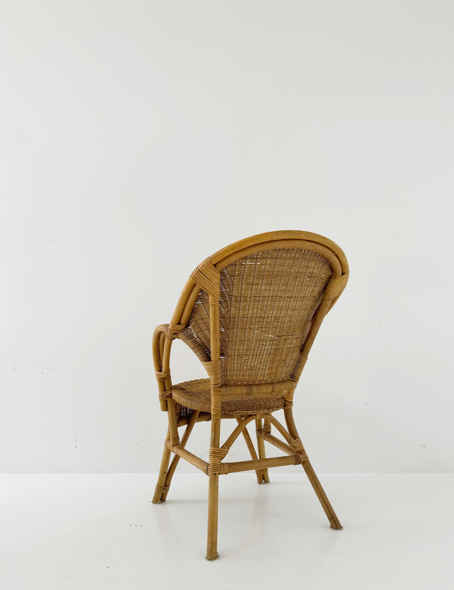 Woven rattan armchair