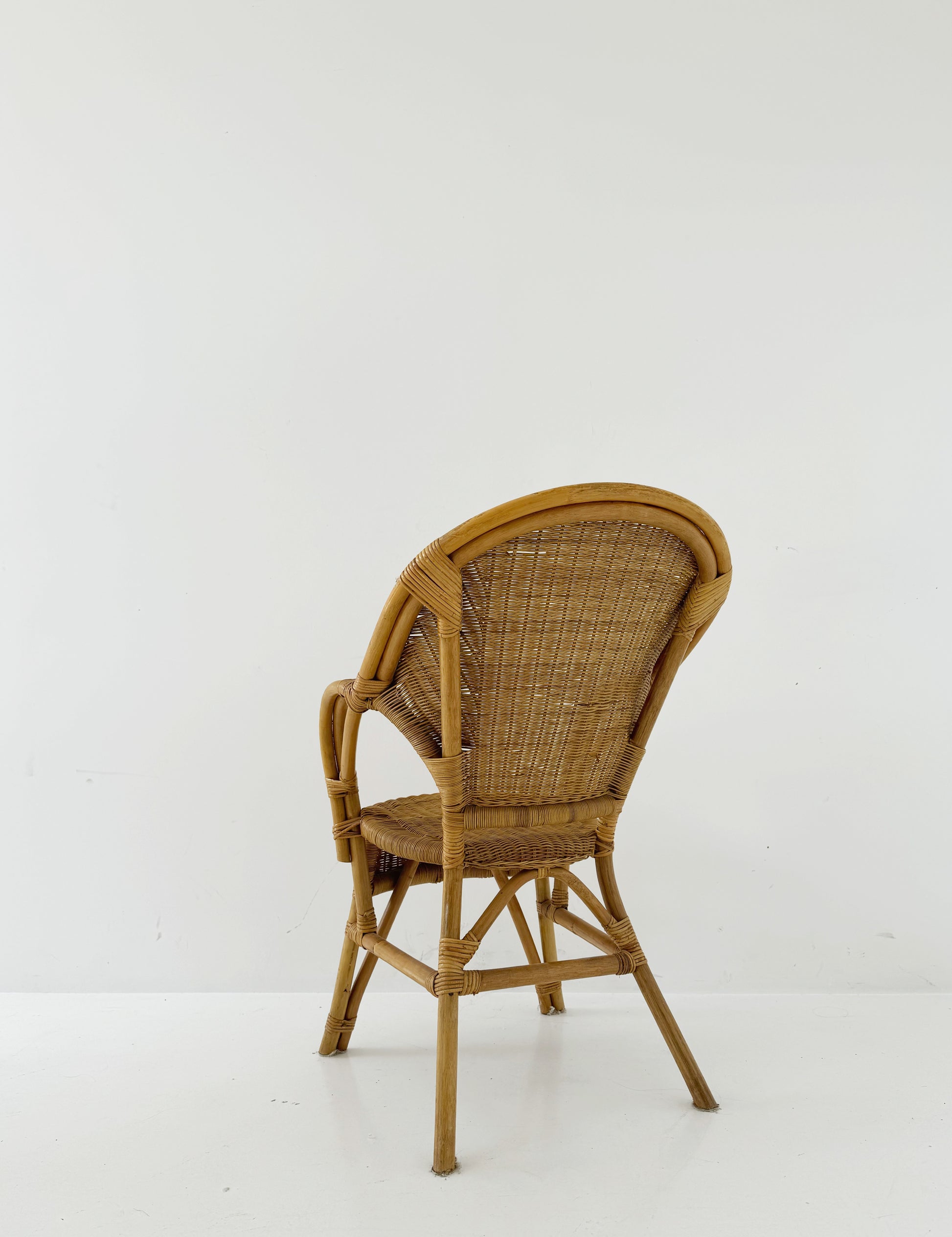 Woven rattan armchair