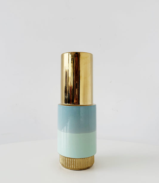 Sculptural ceramic vase in blue with gold accents