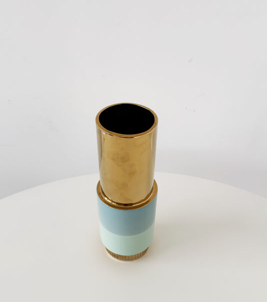 Sculptural ceramic vase in blue with gold accents