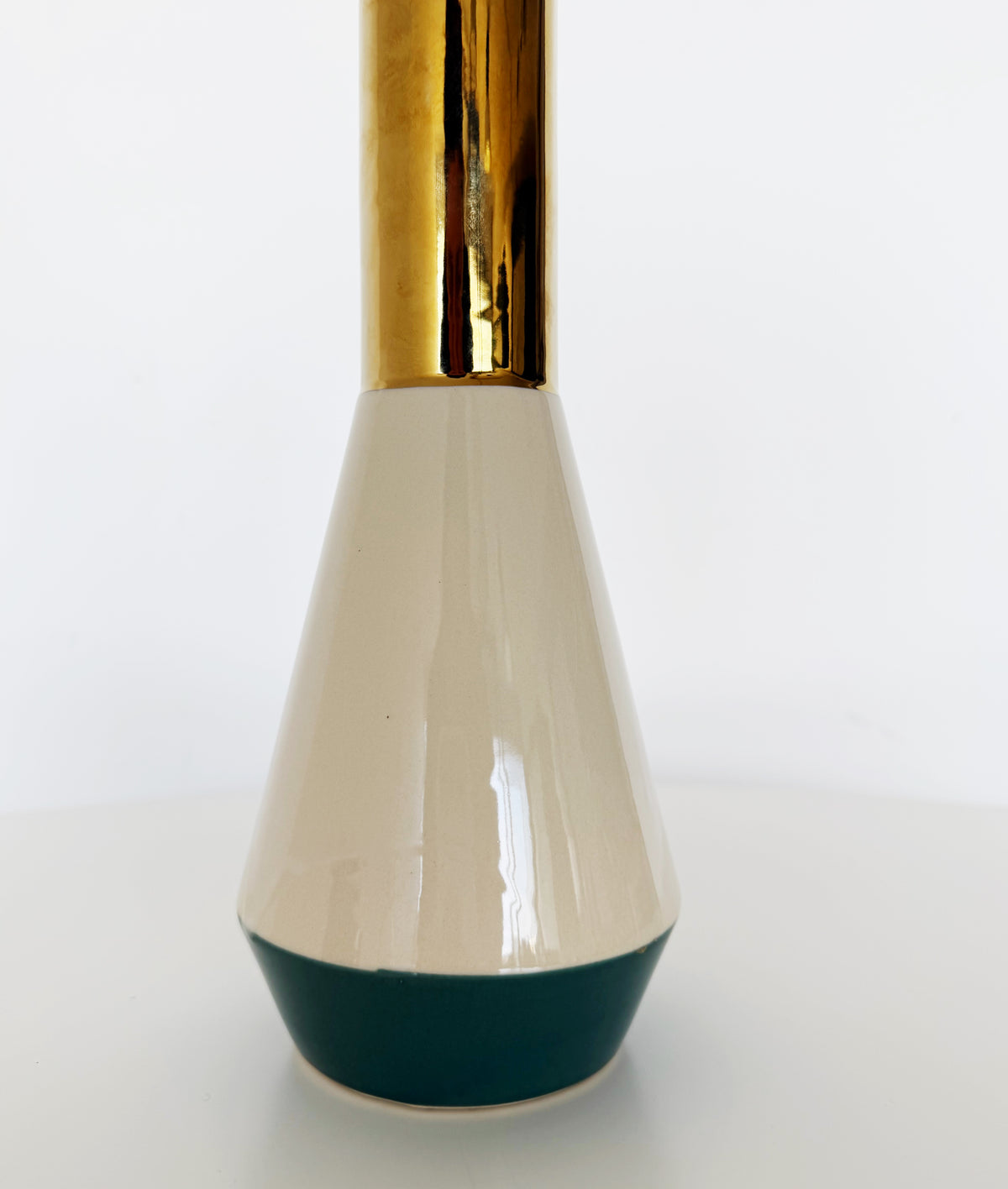 Decorative ceramic vase with gold accents
