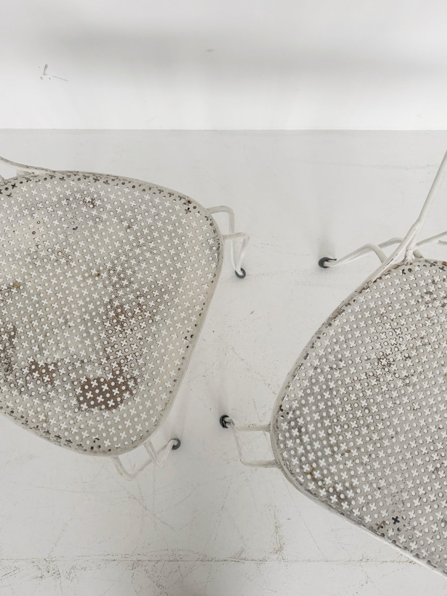 Pair of vintage wrought iron garden chairs