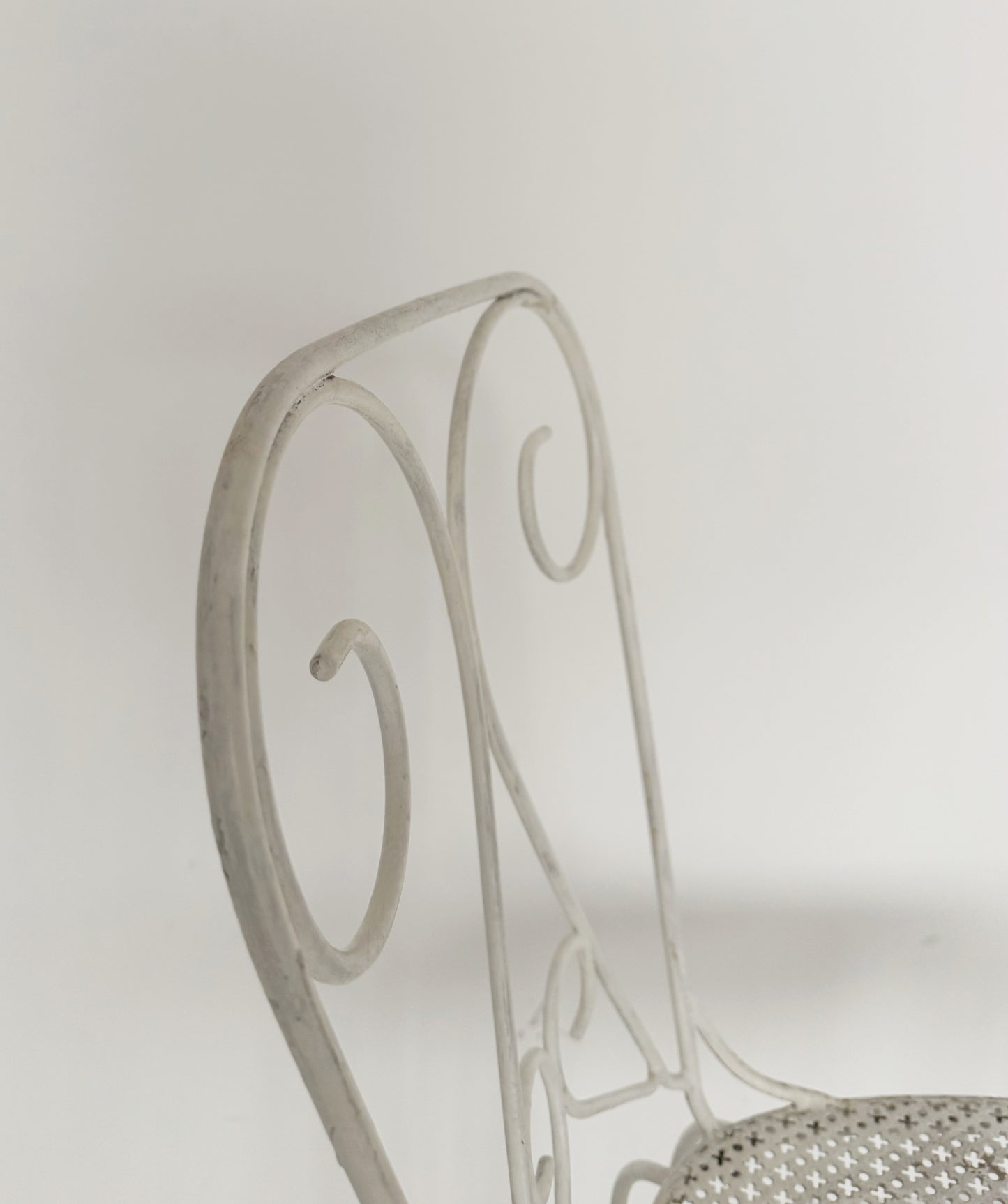 Pair of vintage wrought iron garden chairs