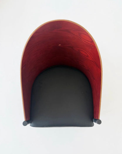 Sculptural armchair in curved wood