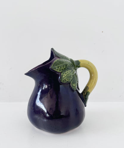 Glazed ceramic pitcher shaped like an eggplant