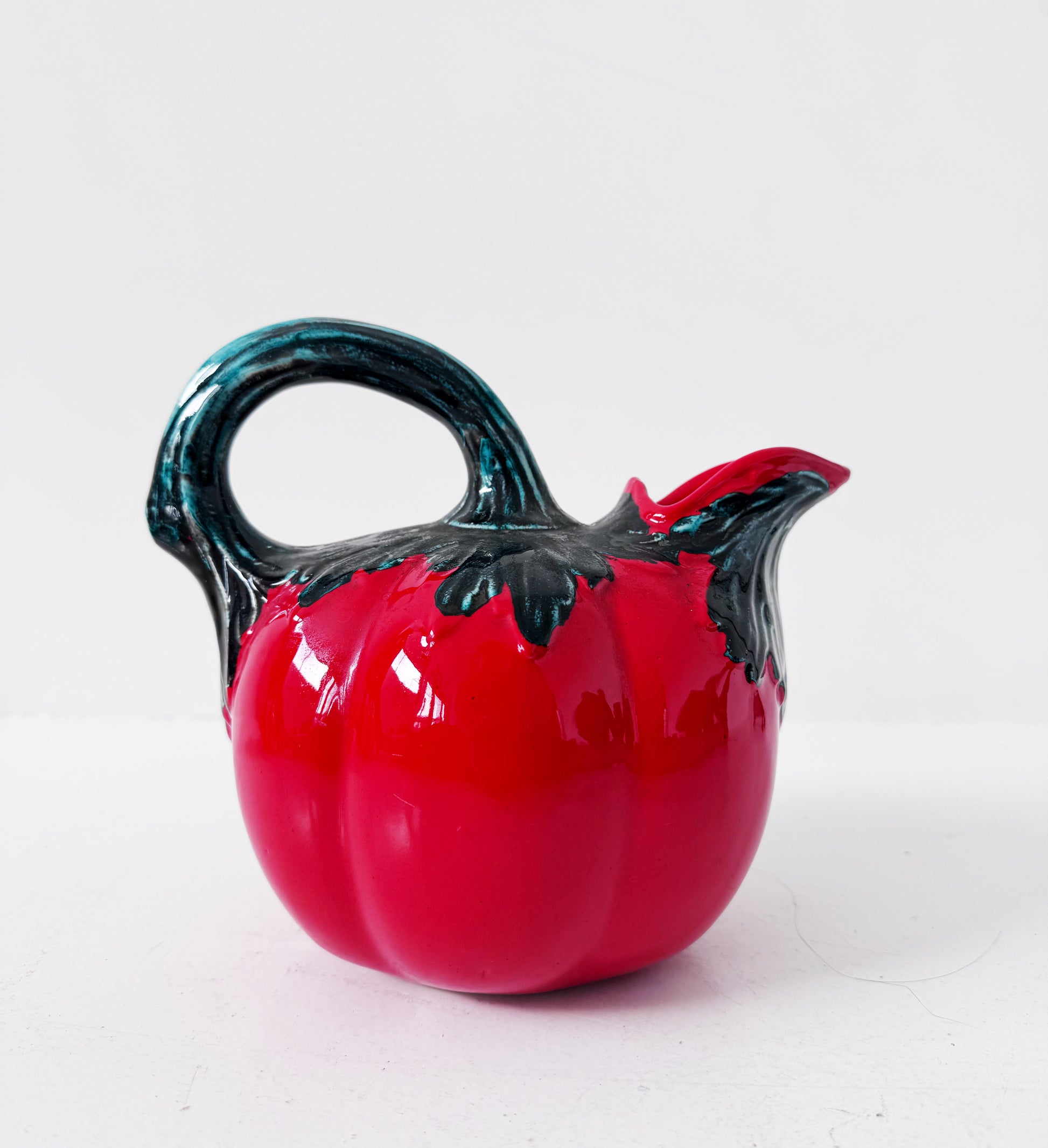 Glazed ceramic tomato-shaped pitcher