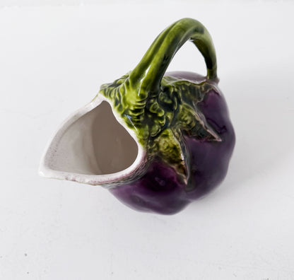 Glazed ceramic pitcher shaped like an eggplant
