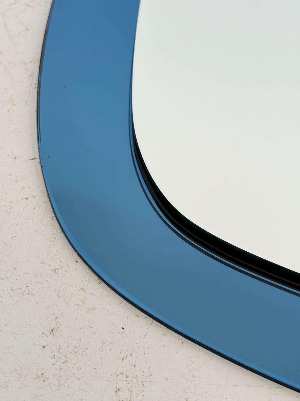 Shaped mirror with blue glass frame – Italian production, 1970s