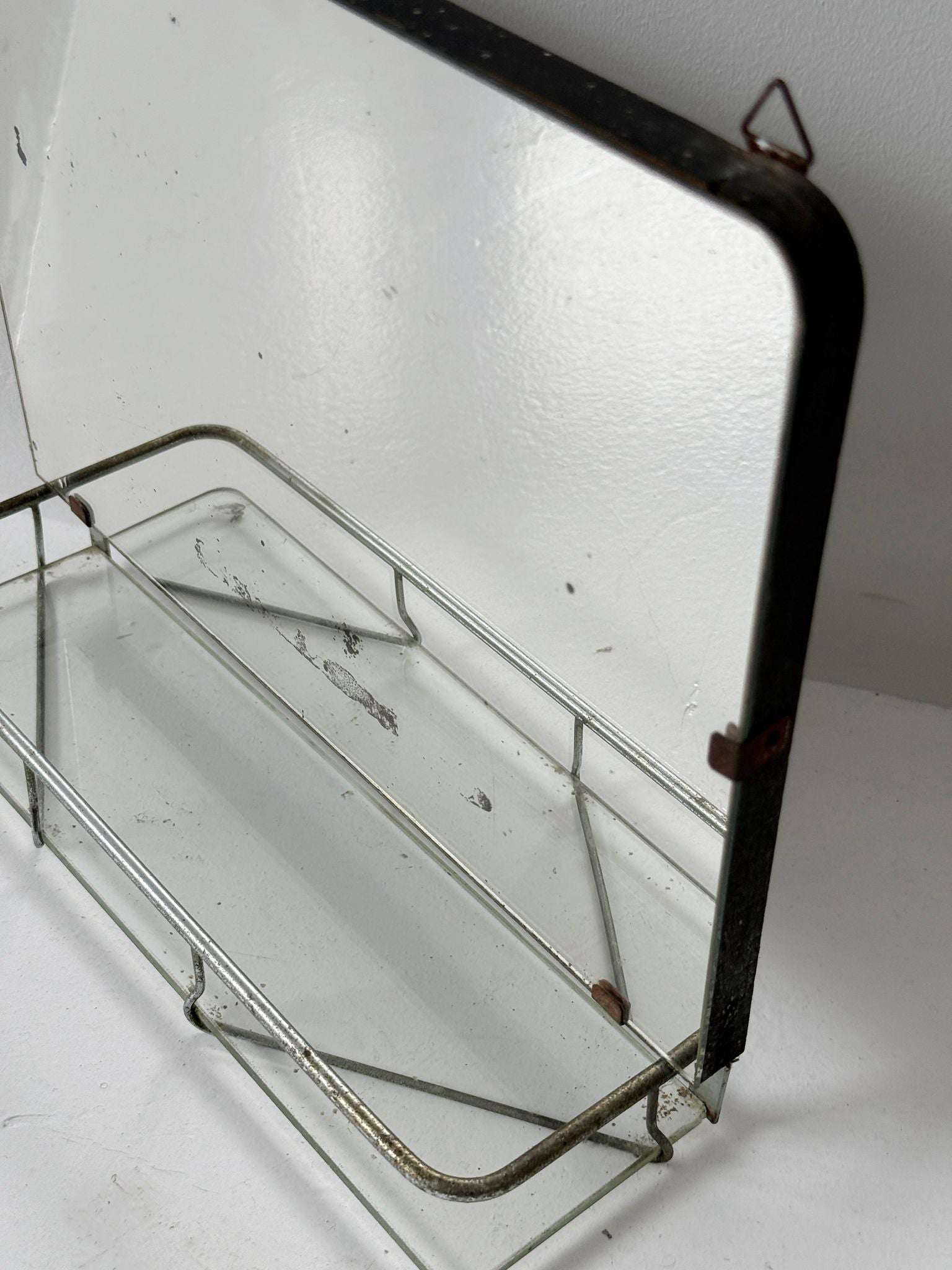 Small wall mirror with glass shelf