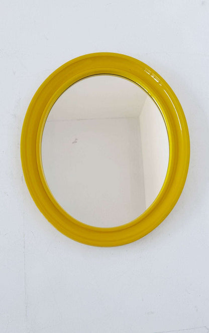 Oval wall mirror with yellow frame