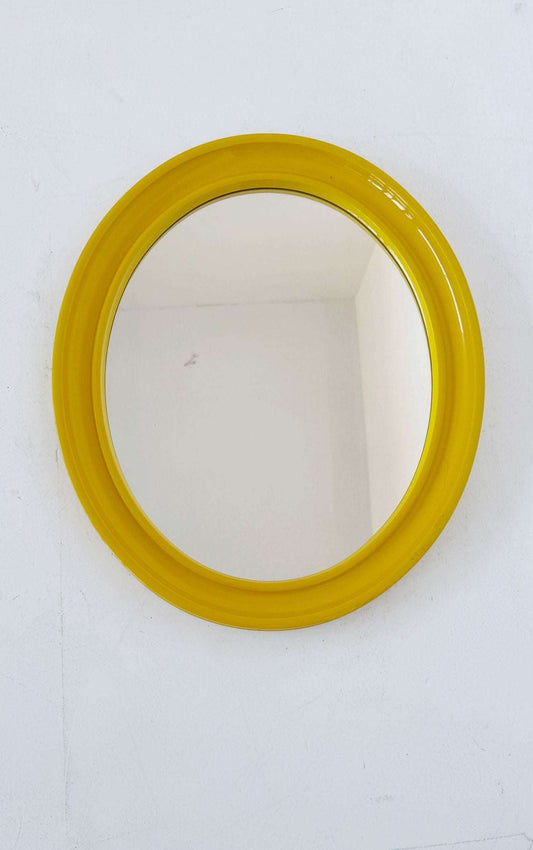 Oval wall mirror with yellow frame