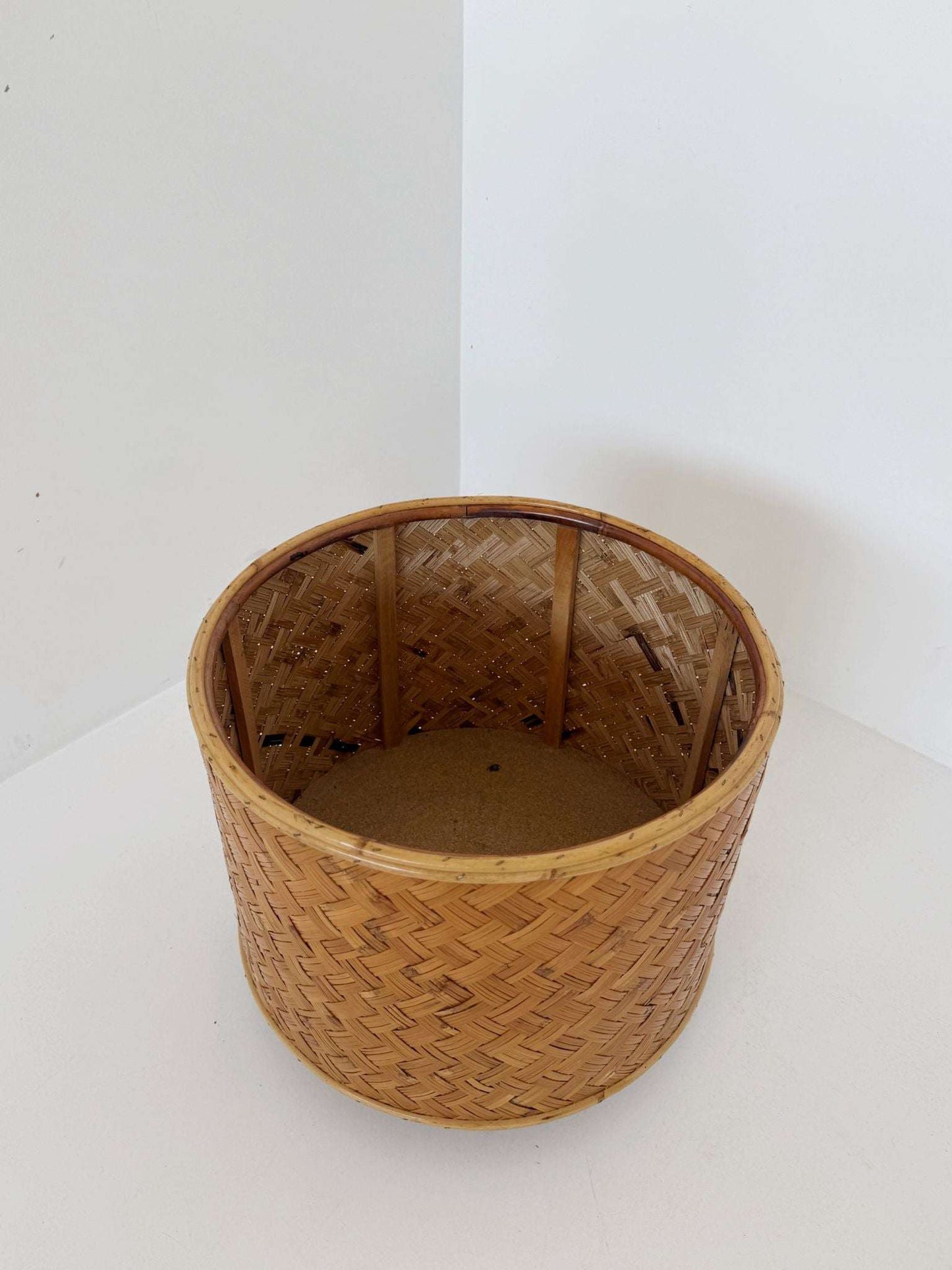 Woven wicker flower stand with wheels