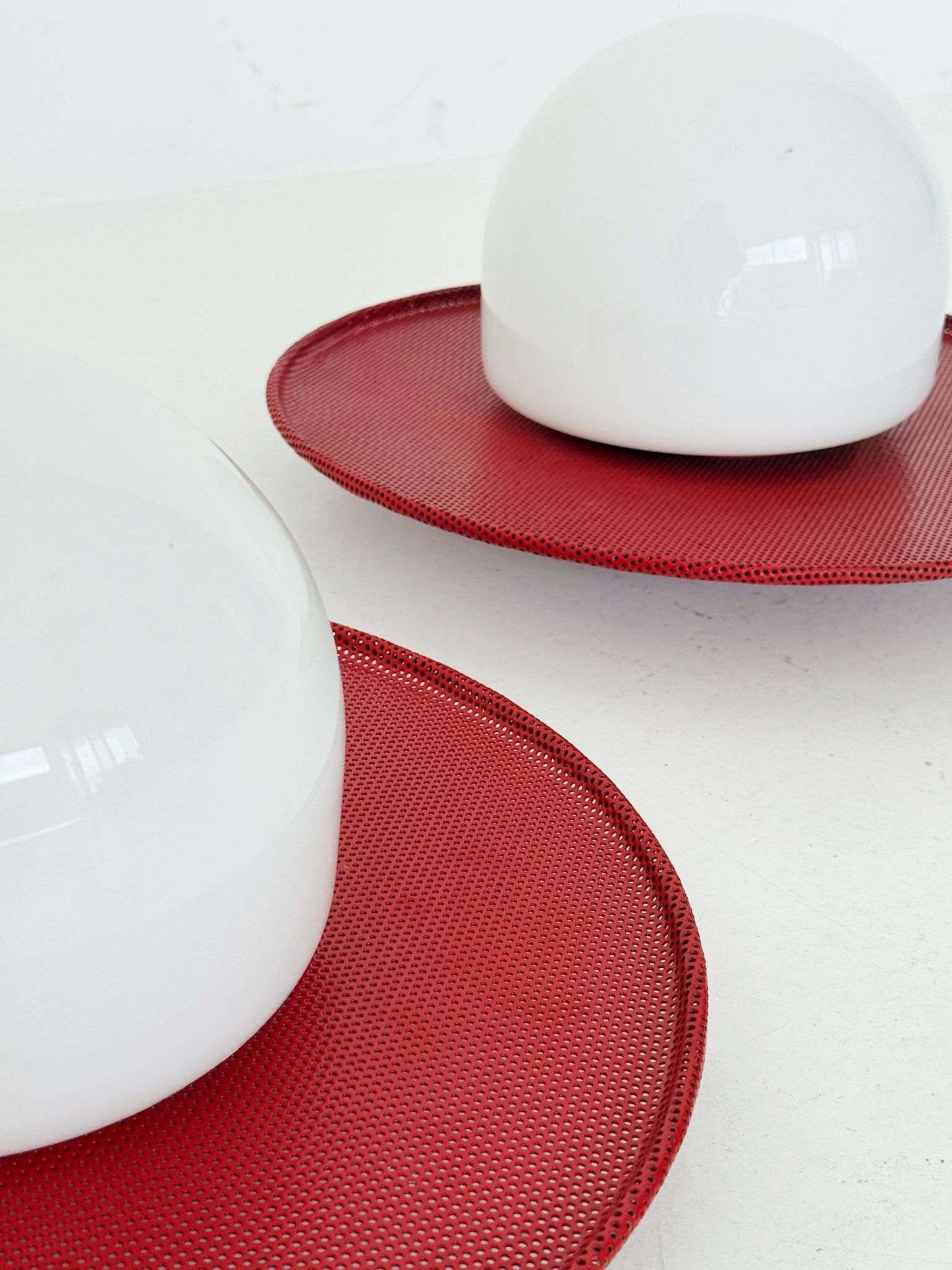 Circular wall lights in micro-perforated metal and opal glass