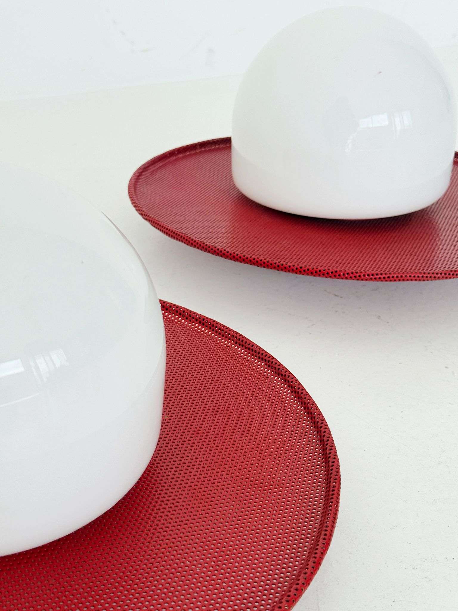 Circular wall lights in micro-perforated metal and opal glass