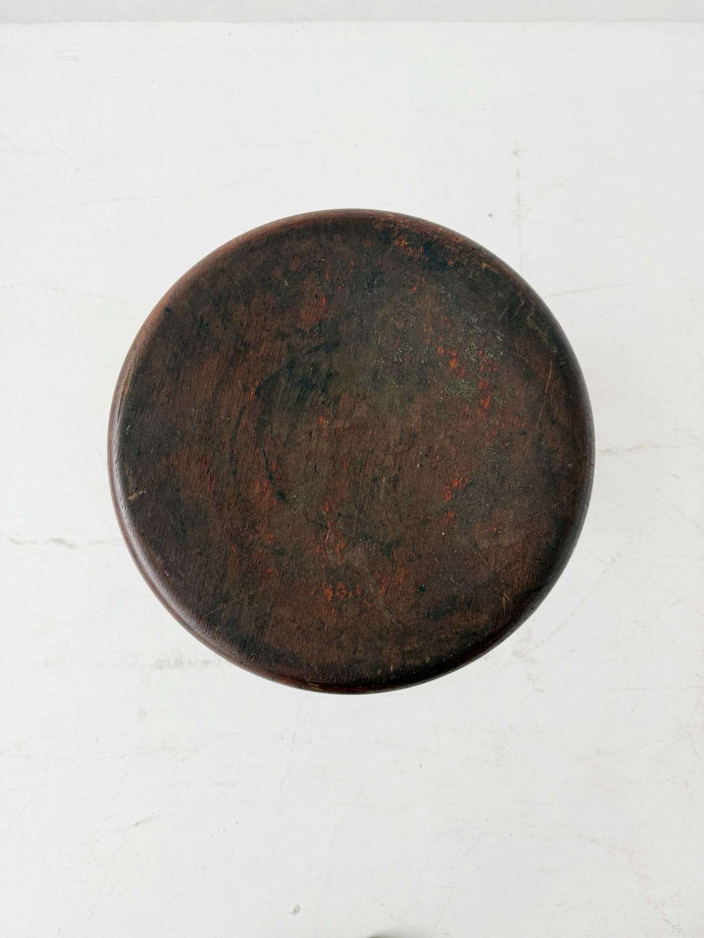 An adjustable industrial stool with a distinctly workshop/laboratory feel, boasting a strong, authentic presence.