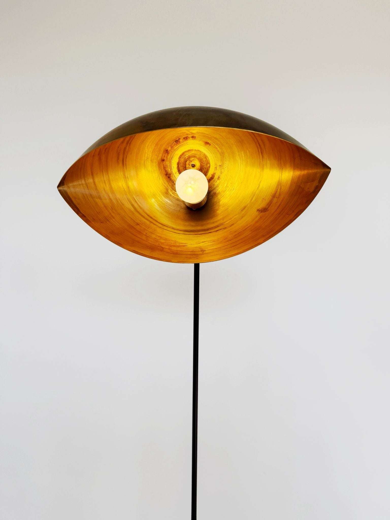 Contemporary floor lamp in brass and painted metal