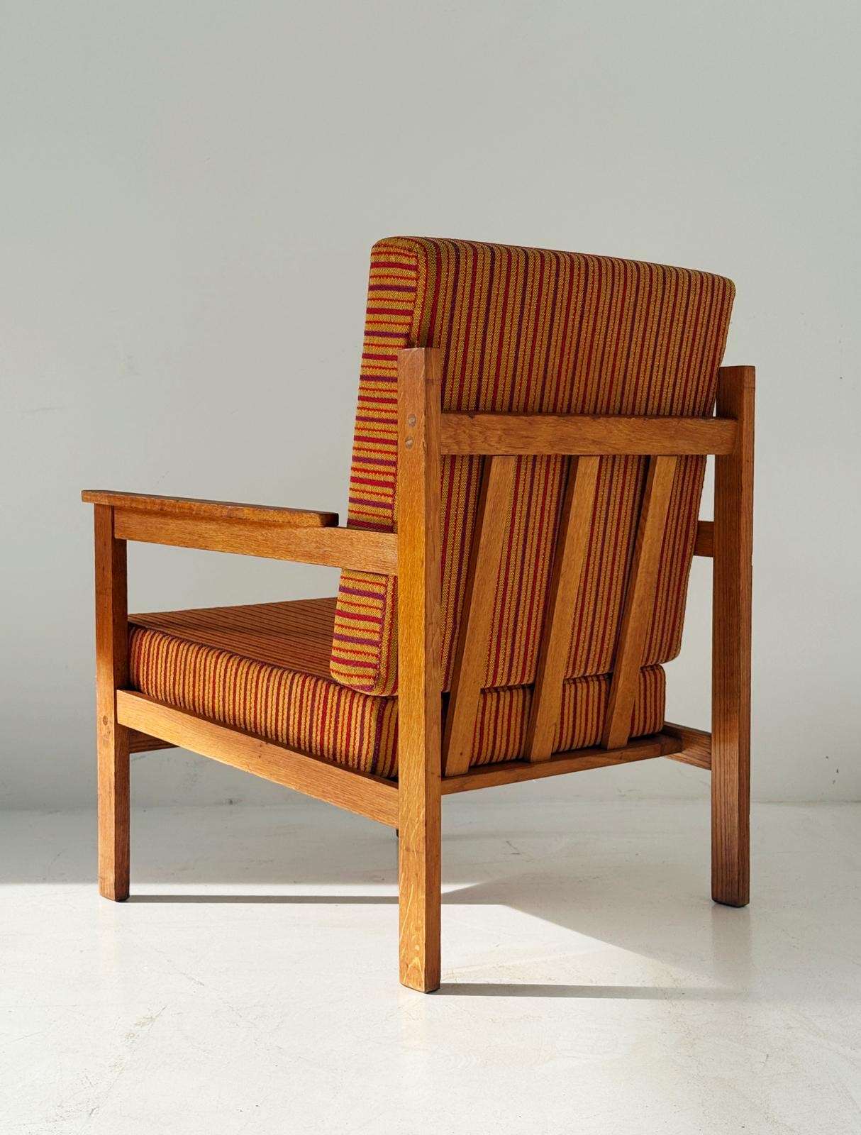 Solid wood armchair with striped upholstery
