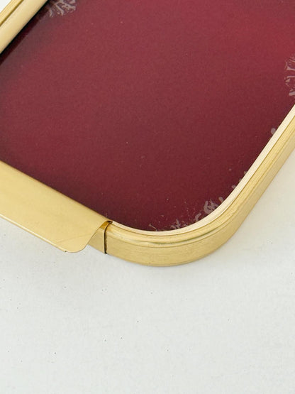 Vassoio in metallo dorato e vetro bordeaux, anni ’50-’60
