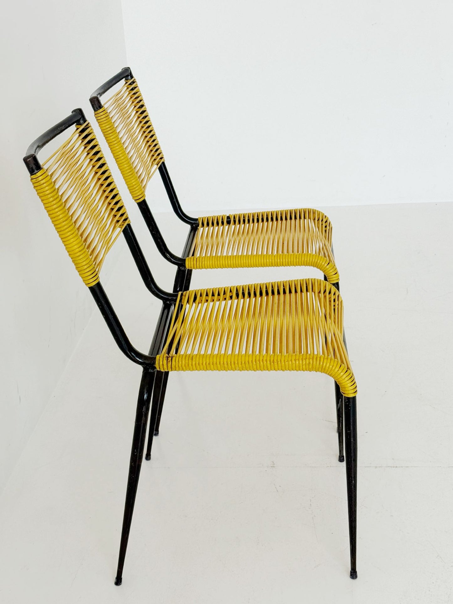 Pair of 1960s design chairs with metal frames and yellow woven detailing