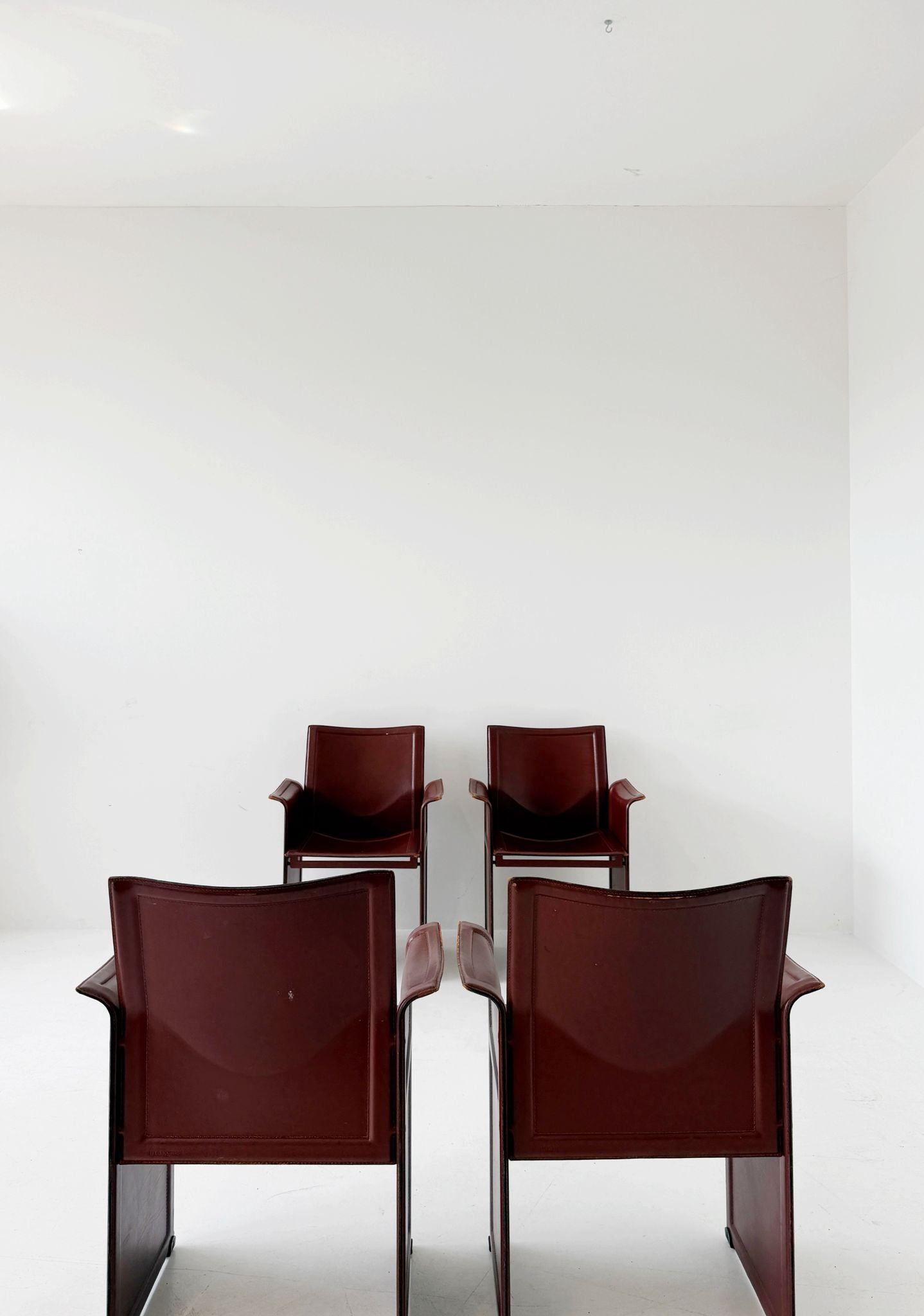 Set of four Matteo Grassi armchairs in burgundy leather, 1980s