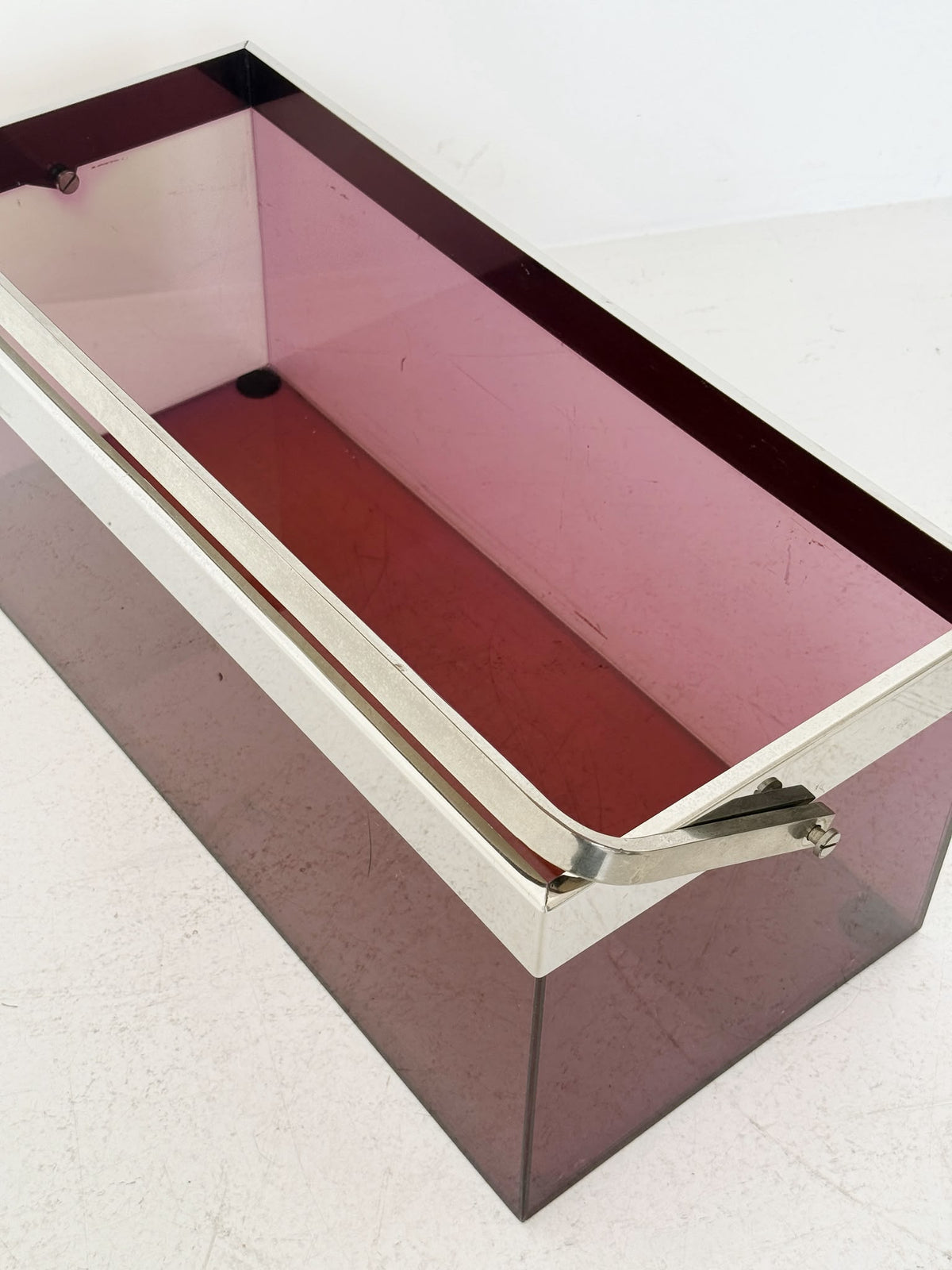 Wine-red Plexiglass container with chrome handle – 1970s