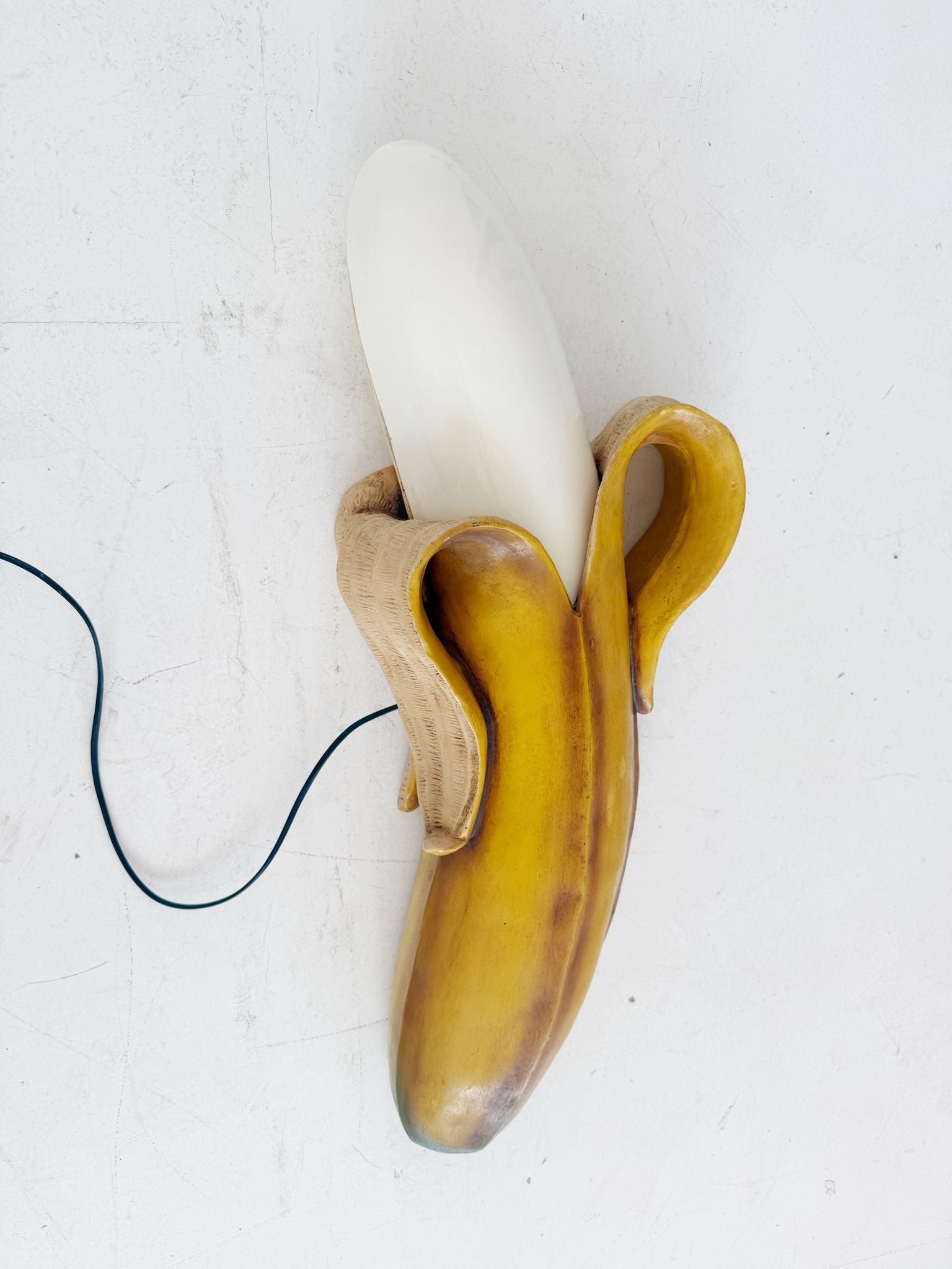 Banana-shaped sculptural wall lamp, 1970s/80s