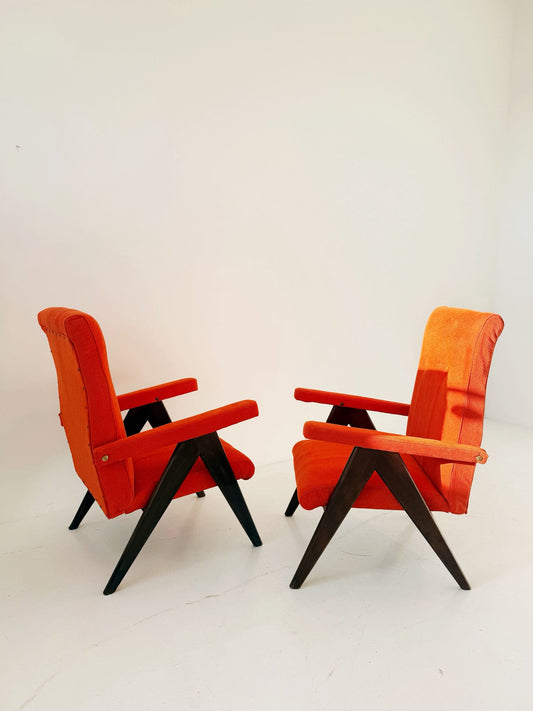A pair of vintage reclining armchairs