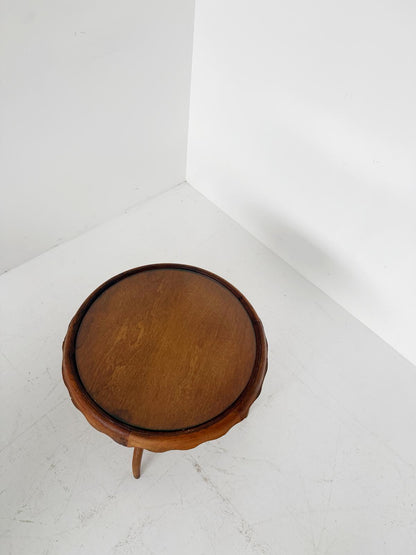 Round coffee table with glass top and wooden frame