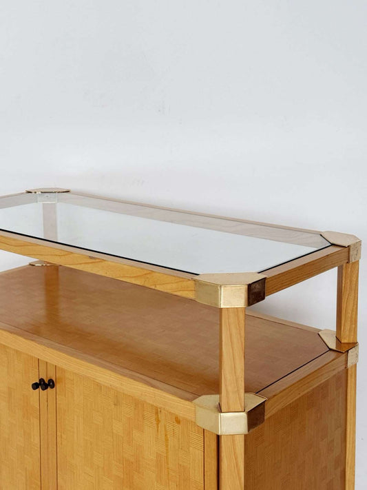 Wooden storage unit with a glass top and gold-tone metal details, 1970s–80s.