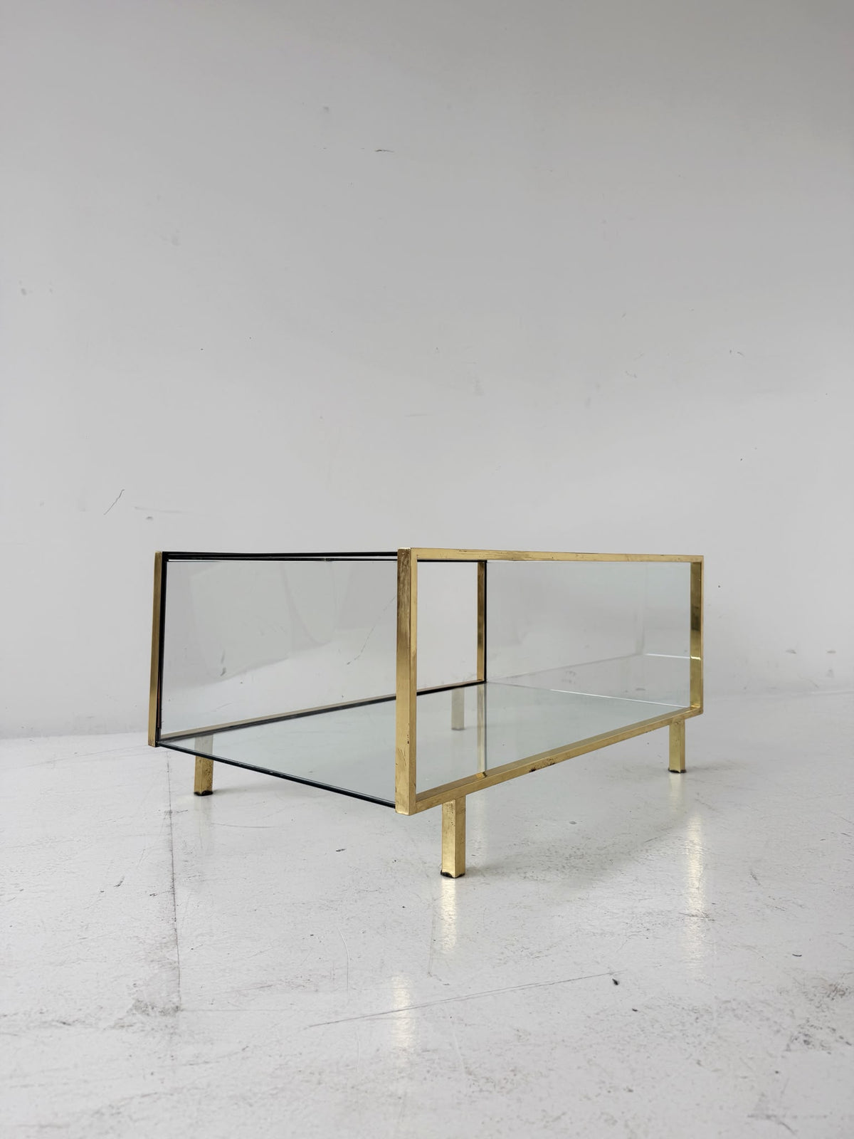 Gold-tone metal and glass coffee table, 1970s.