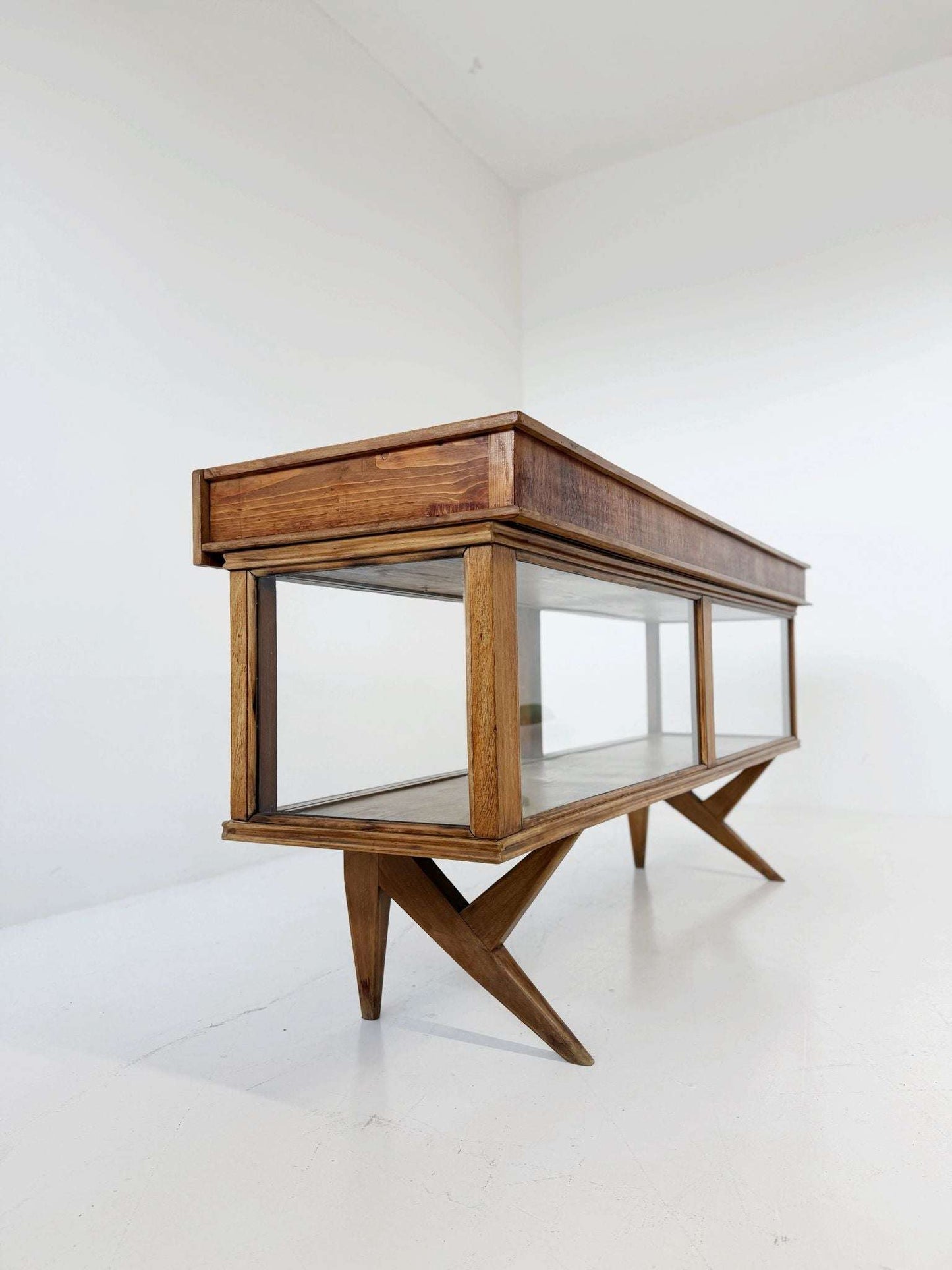 Vintage wooden counter with glass-fronted structure