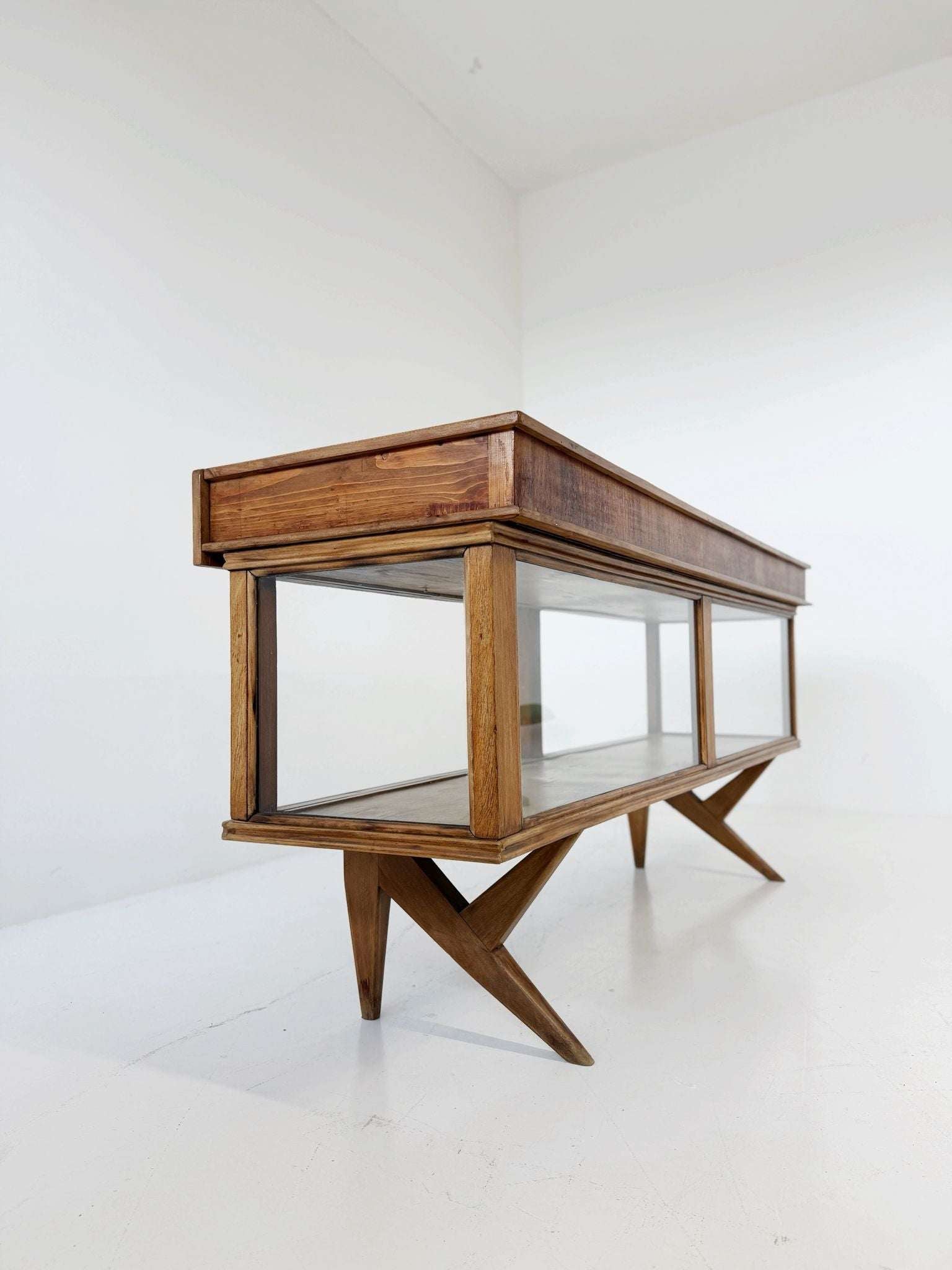 Vintage wooden counter with glass-fronted structure