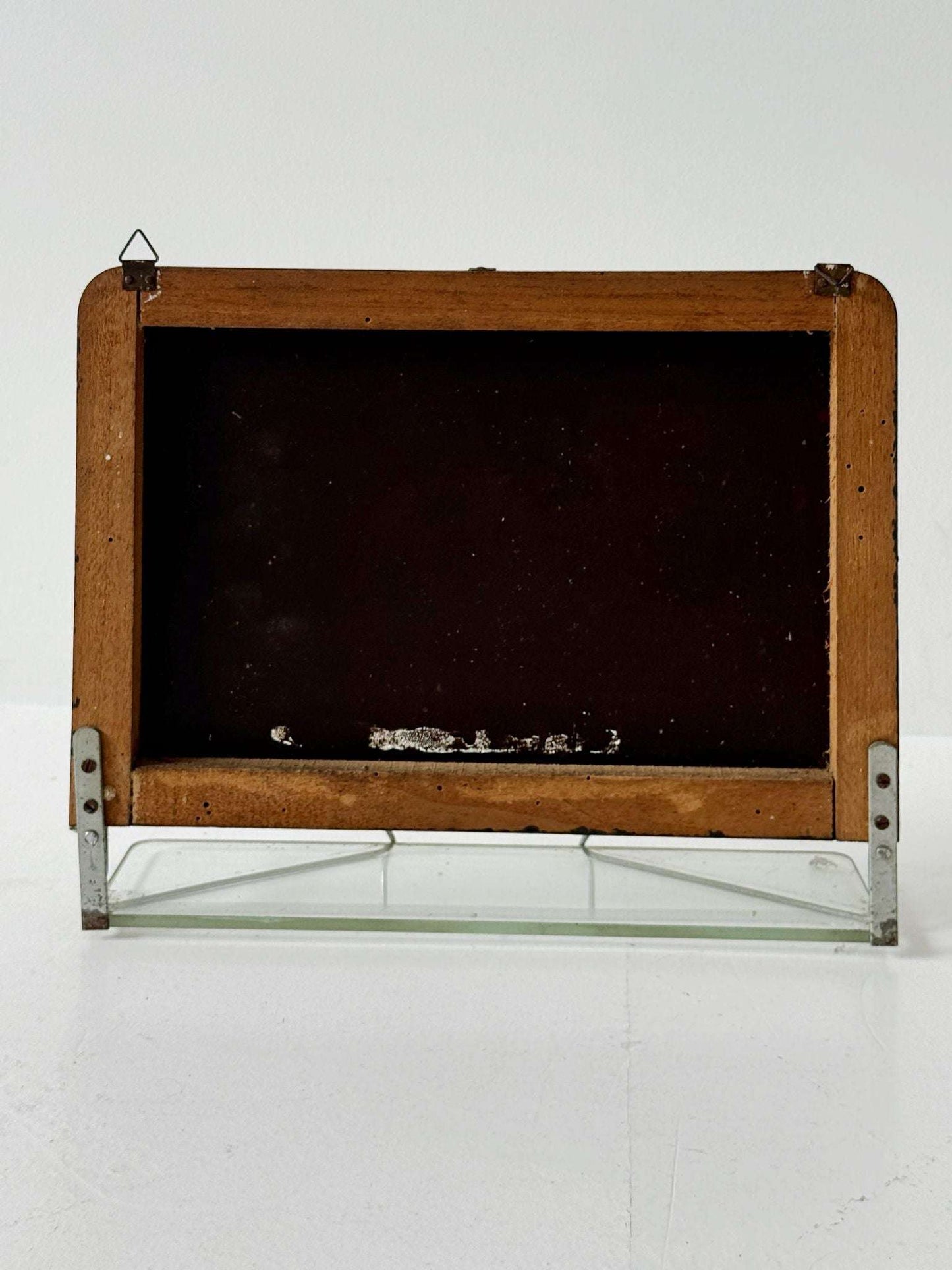 Small wall mirror with glass shelf